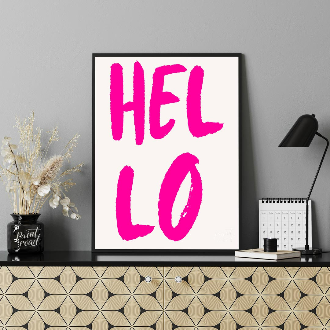 This minimalist yet impactful print features the word “HEL LO” in a bold, distressed, hot pink sans… for office