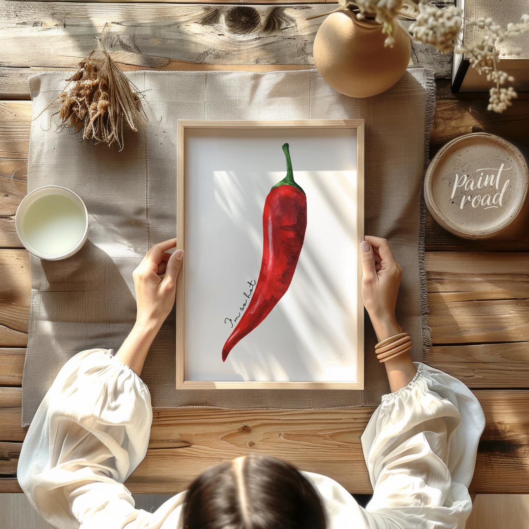 This striking minimalist poster features a single, vibrant red chili pepper rendered in a realistic… for dining room