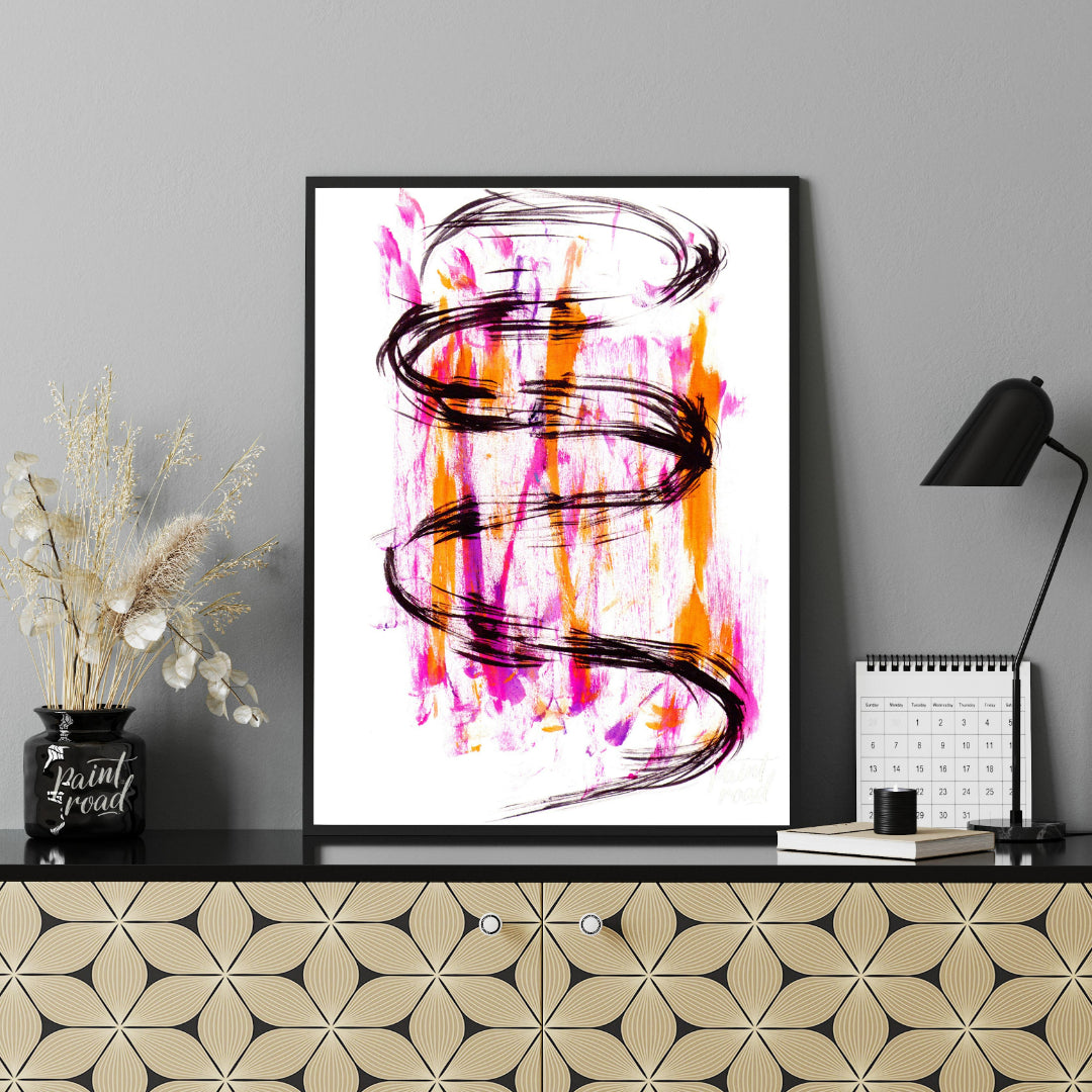 This artwork features a striking black ink spiral against a backdrop of vibrant pink and orange hue… for office