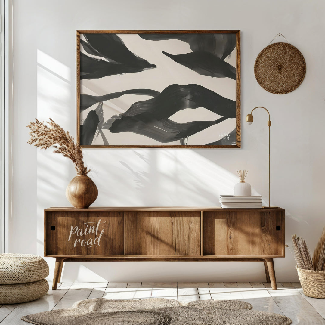 This artwork features a series of dynamic, abstract forms rendered in bold black ink against a ligh… for living room