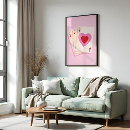 This charming and subtly romantic print features a hand of playing cards against a soft pink backgr… for living room