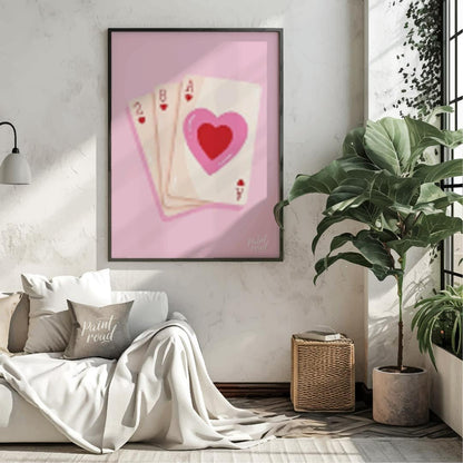 This charming and subtly romantic print features a hand of playing cards against a soft pink backgr… for living room