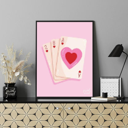 This charming and subtly romantic print features a hand of playing cards against a soft pink backgr… for office