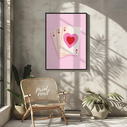This charming and subtly romantic print features a hand of playing cards against a soft pink backgr… for other