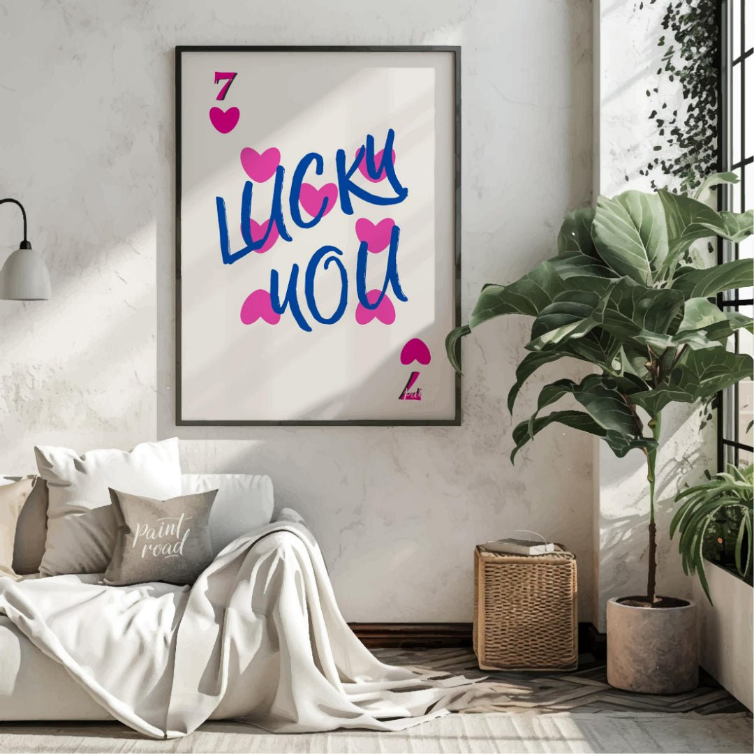 This playful and visually striking graphic features the phrase “LUCKY YOU” in bold, brushstroke-sty… for living room