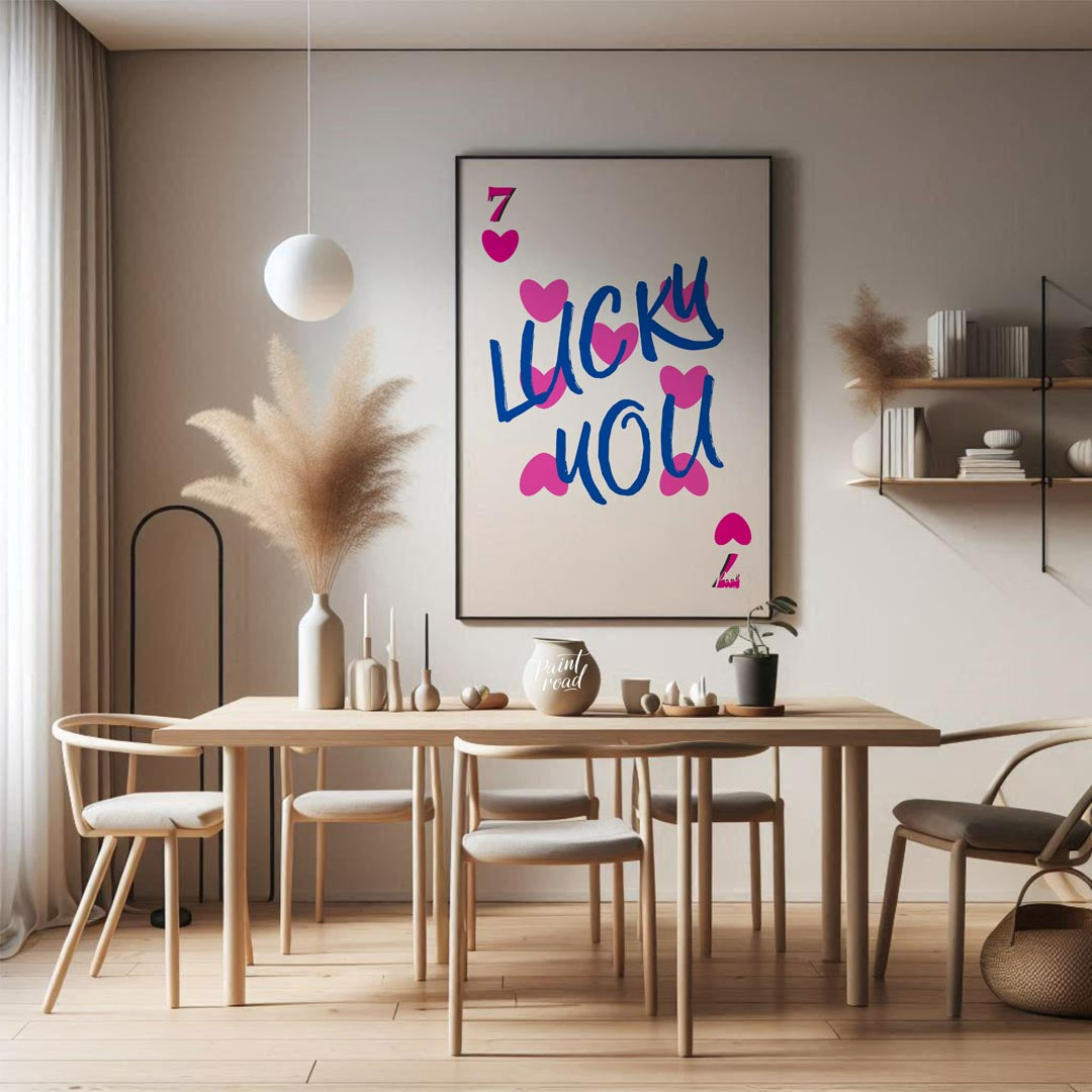 This playful and charming print features the phrase “LUCKY YOU” in a bold, hand-drawn blue script, … for dining room