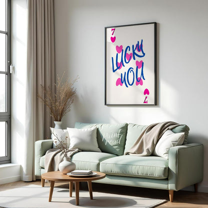 This playful and charming print features the phrase “LUCKY YOU” in a bold, hand-drawn blue script, … for living room
