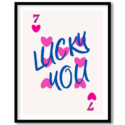 This playful and charming print features the phrase “LUCKY YOU” in a bold, hand-drawn blue script, … for place