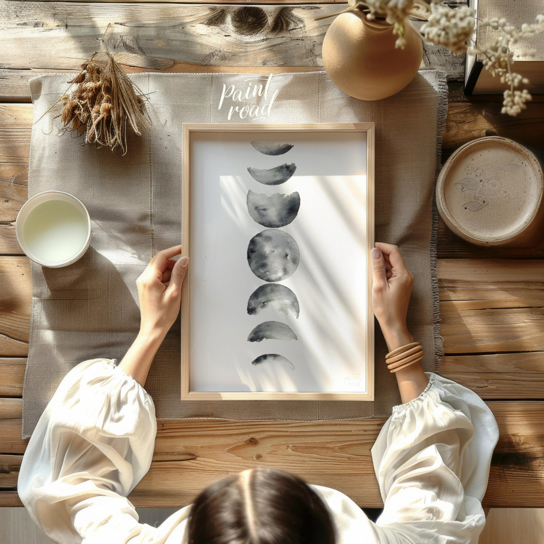 """Lunar Phases"" presents a delicate watercolor rendering of the moon's cycle, depicted in a verti… for dining room