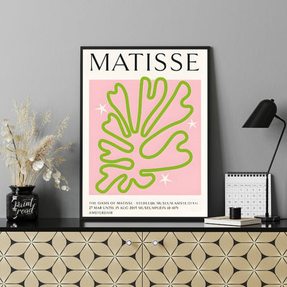 This poster showcases a captivating Matisse-inspired cut-out design, featuring a vibrant green, org… for office