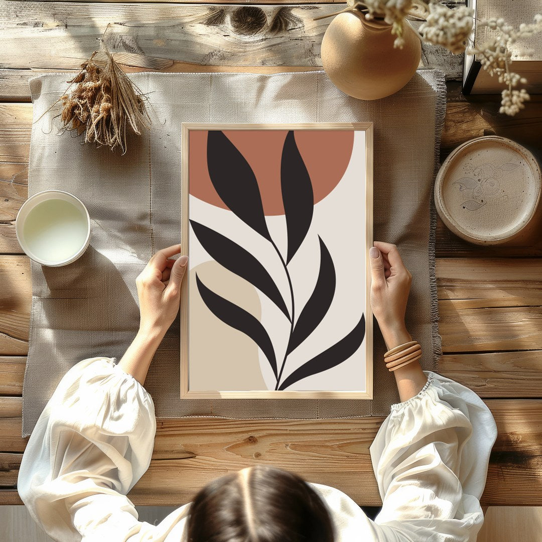 This stunning minimalist piece features a bold black botanical silhouette set against calming earth for Kitchen