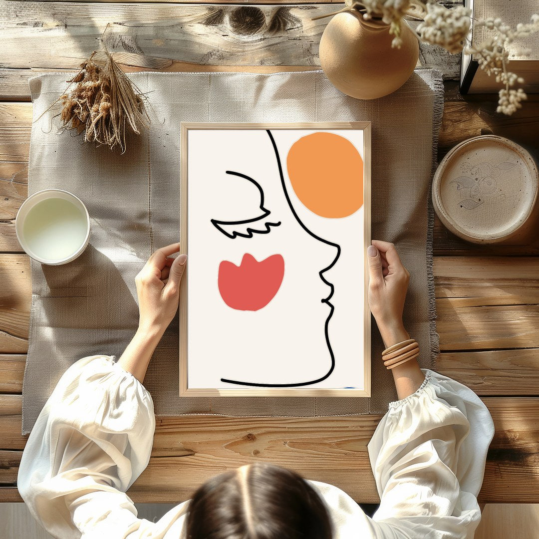This elegant wall art piece features a minimalist line drawing of a face, juxtaposed with bold for Kitchen