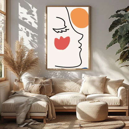 This elegant wall art piece features a minimalist line drawing of a face, juxtaposed with bold for Sitting Area