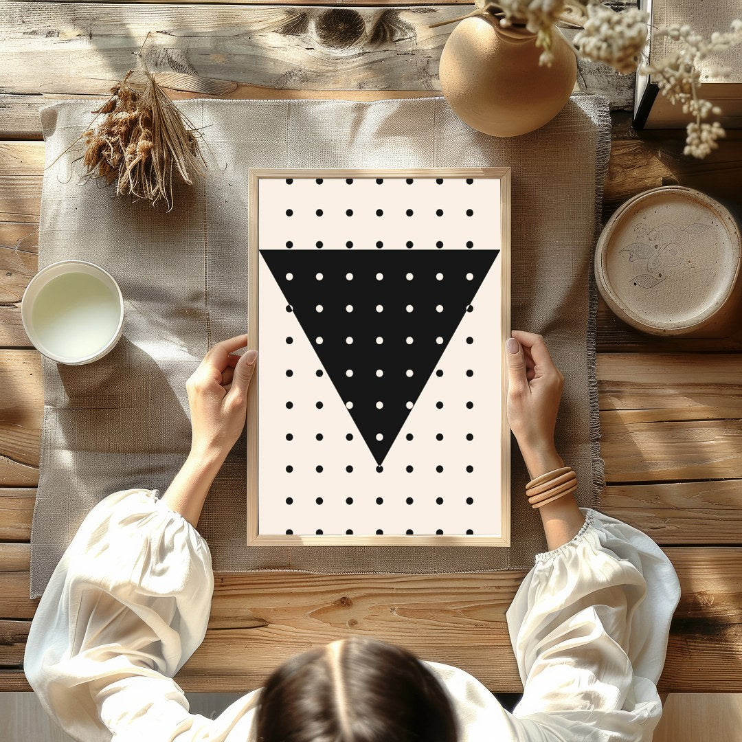 This contemporary wall art piece features a striking black inverted triangle adorned with evenly for Kitchen