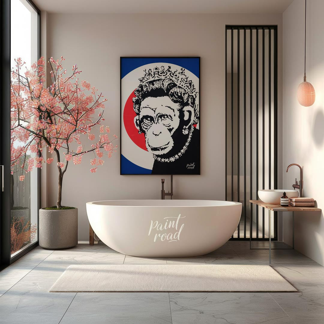 This provocative art print features Banksy’s “Monkey Queen” stencil, portraying Queen Elizabeth II … for bathroom