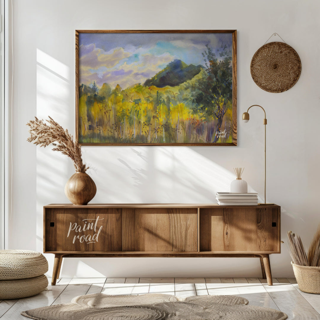 This watercolor painting captures a serene landscape with a mountain rising in the distance, framed… for living room