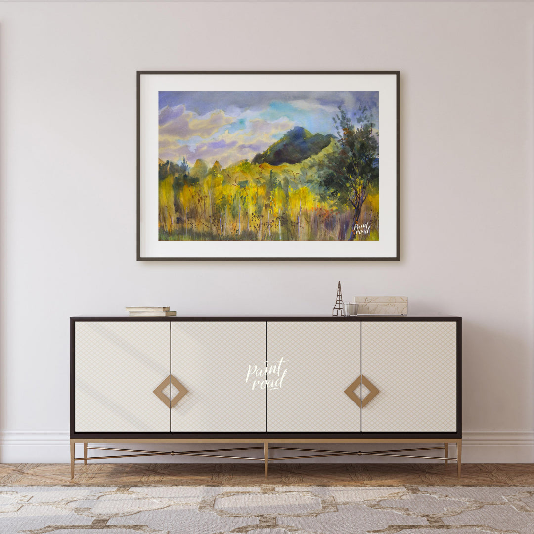 This watercolor painting captures a serene landscape with a mountain rising in the distance, framed… for living room