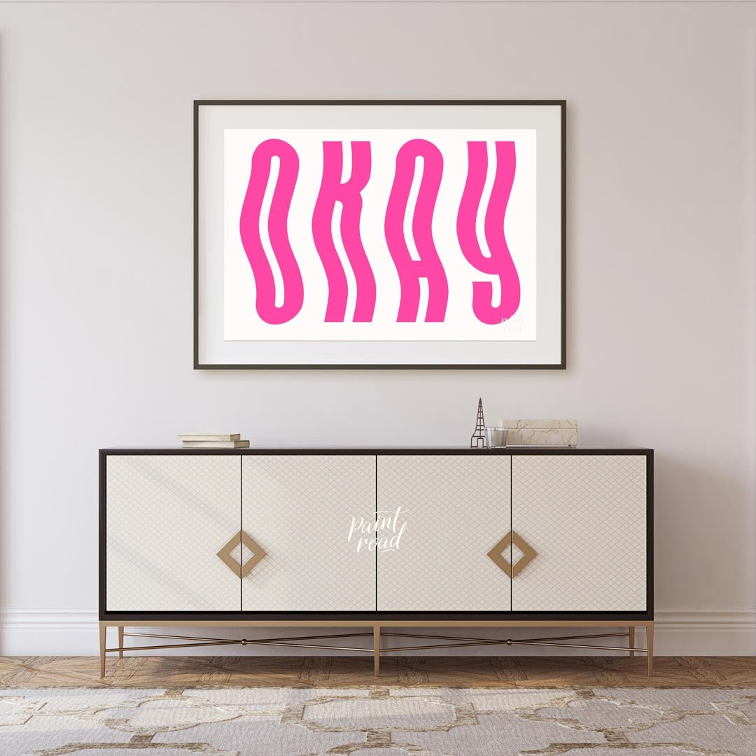 This minimalist and playful graphic features the word “OKAY” in large, bold, hot pink letters. The … for living room
