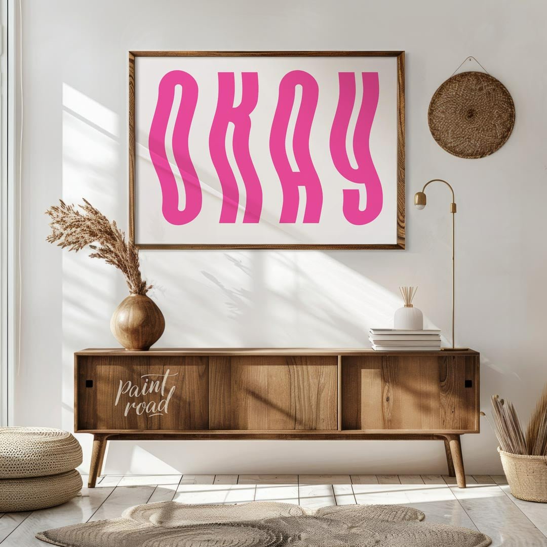 This minimalist and playful graphic features the word “OKAY” in large, bold, hot pink letters. The … for living room