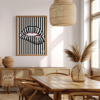 This striking art print features a close-up of an open mouth with lips adorned in a bold black and … for dining room