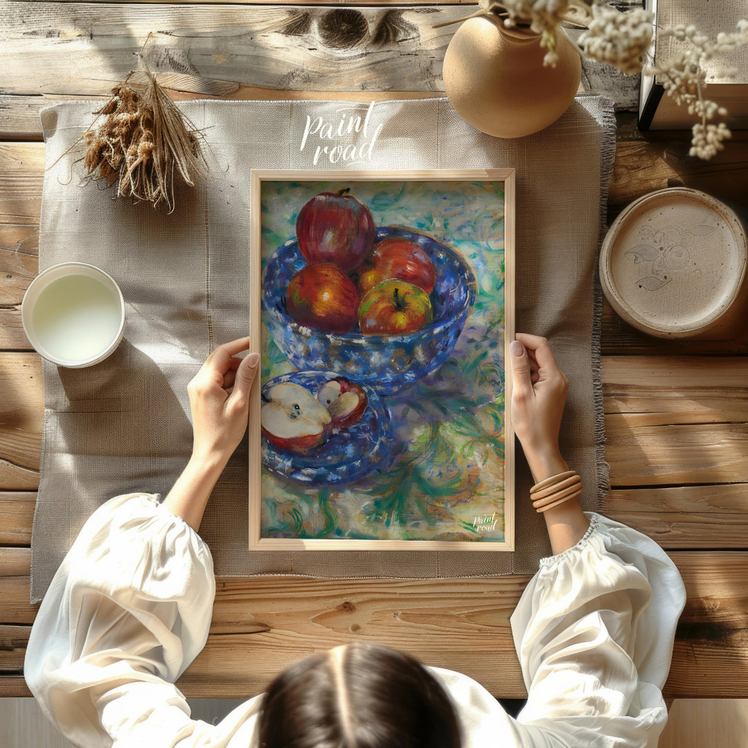 This still life painting captures a rustic scene with a blue patterned bowl filled with ripe apples… for other