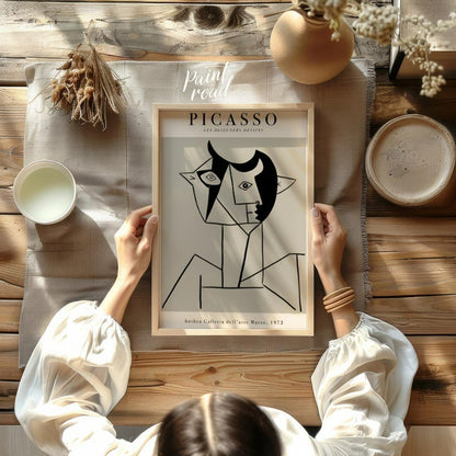 This poster features a striking line drawing by Pablo Picasso, characteristic of his distinctive cu… for other