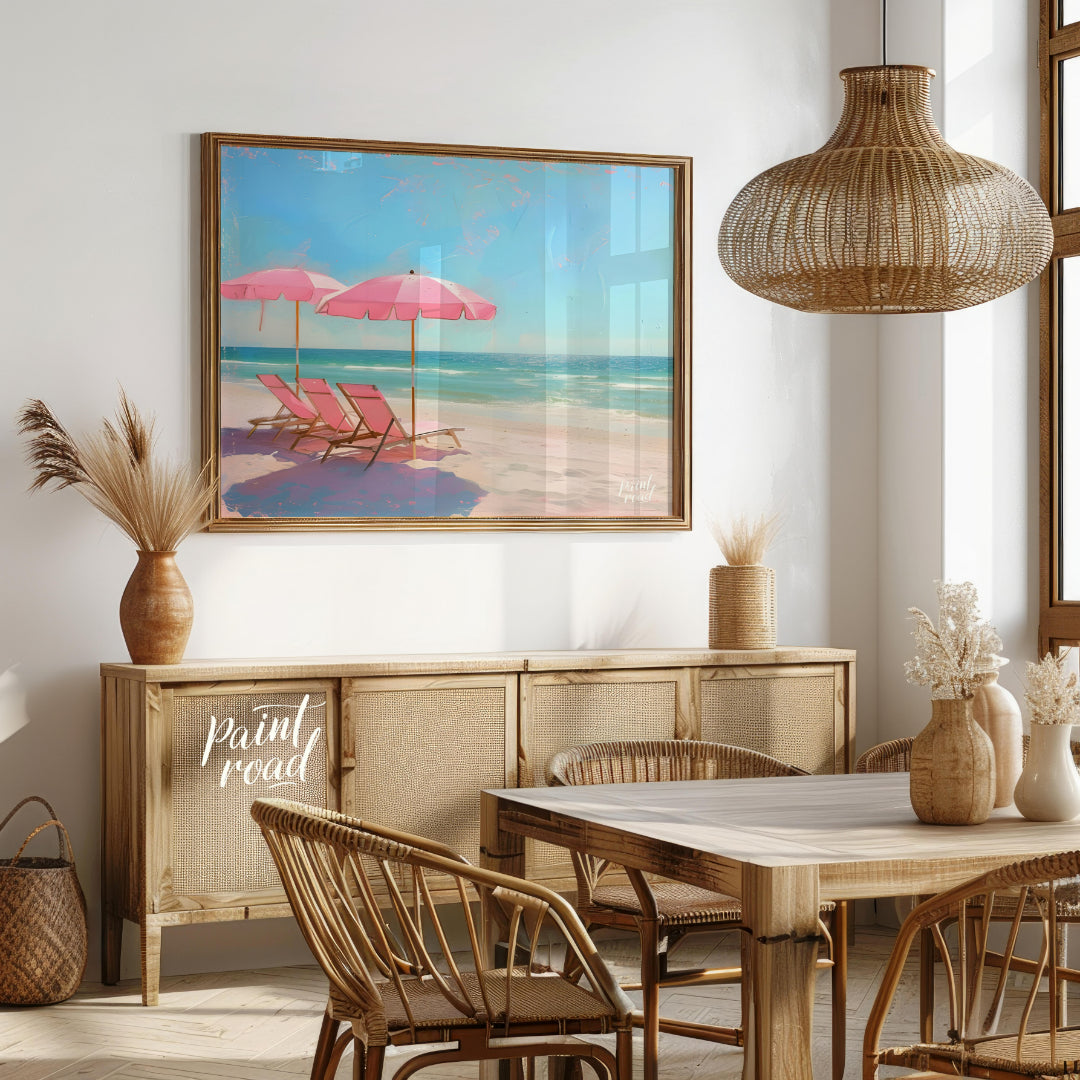 This artwork captures a tranquil beach scene with two pink parasols and matching lounge chairs set … for dining room