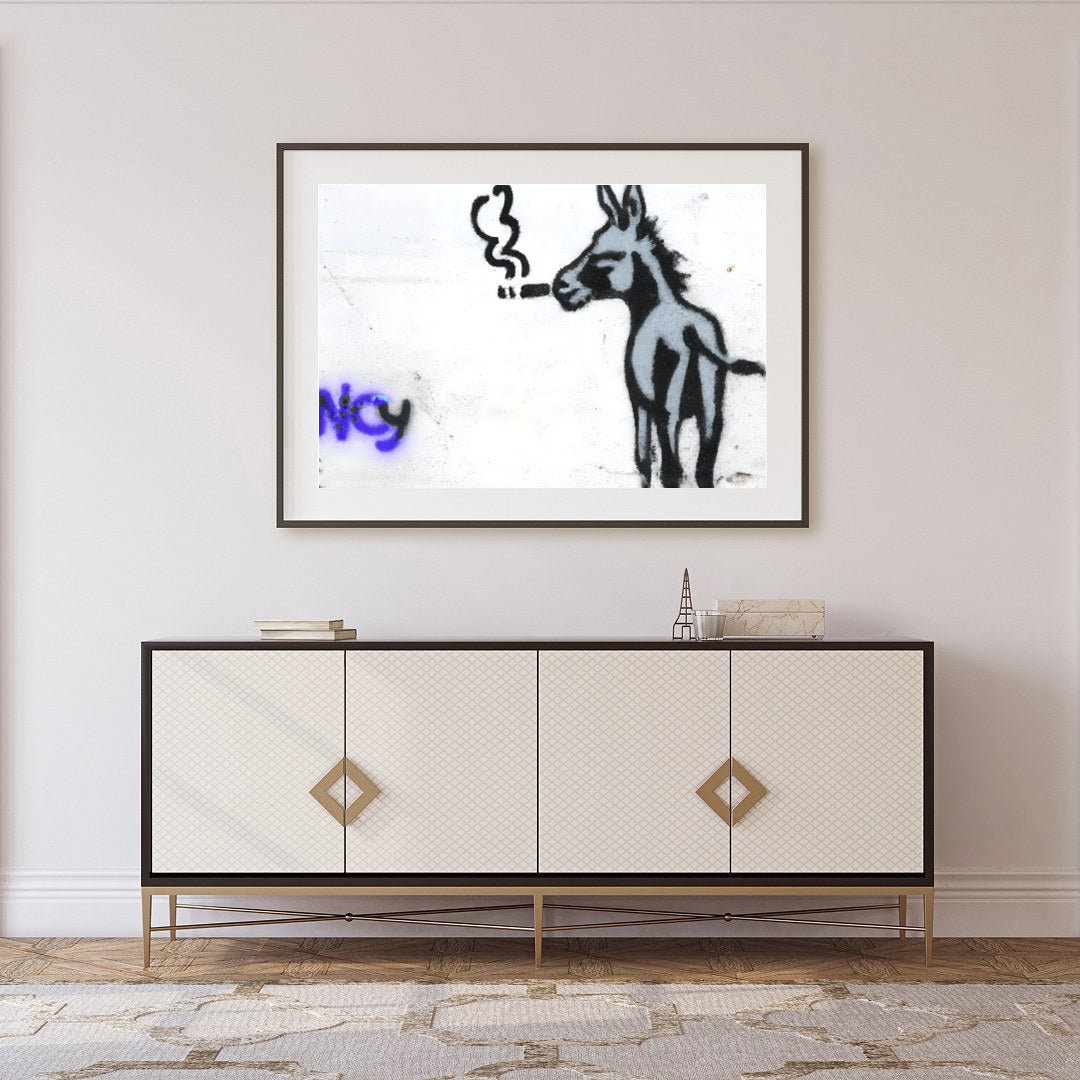 This whimsical piece captures a donkey in an unexpected urban context, exuding playful charm and for Foyer