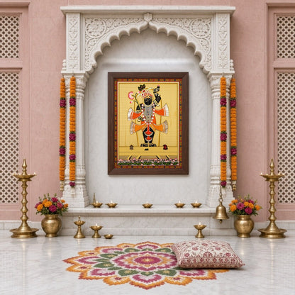Capture the divine elegance of Shrinathji in this exquisite Pichwai painting, adorned with an array for Home Temple