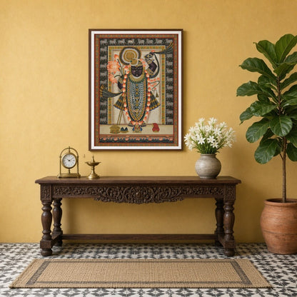 Celebrate the captivating grace of Shrinathji in this mesmerizing Pichwai artwork. Adorned with a for Entrance