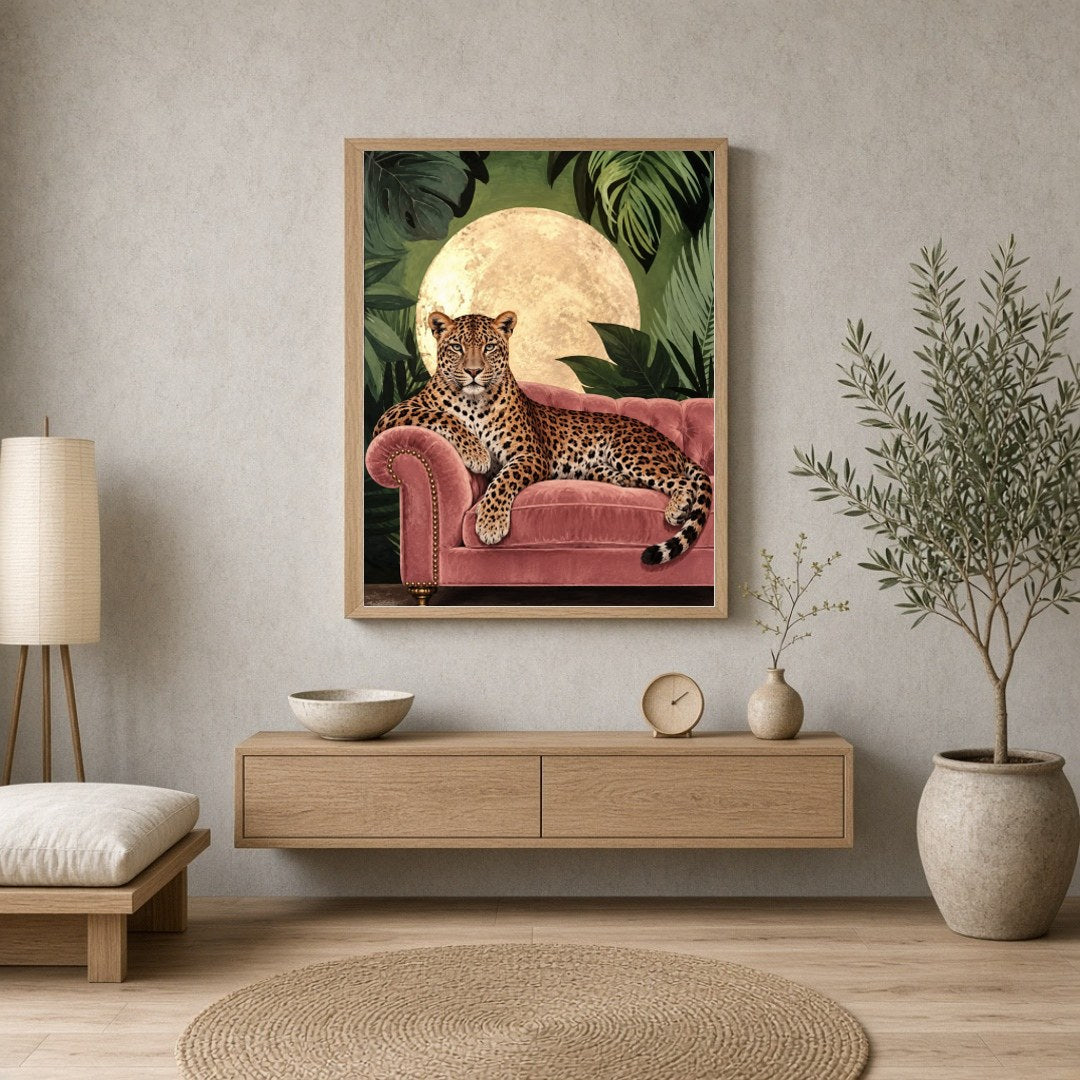 This captivating art print features a majestic leopard elegantly lounging on a plush pink velvet for Entrance