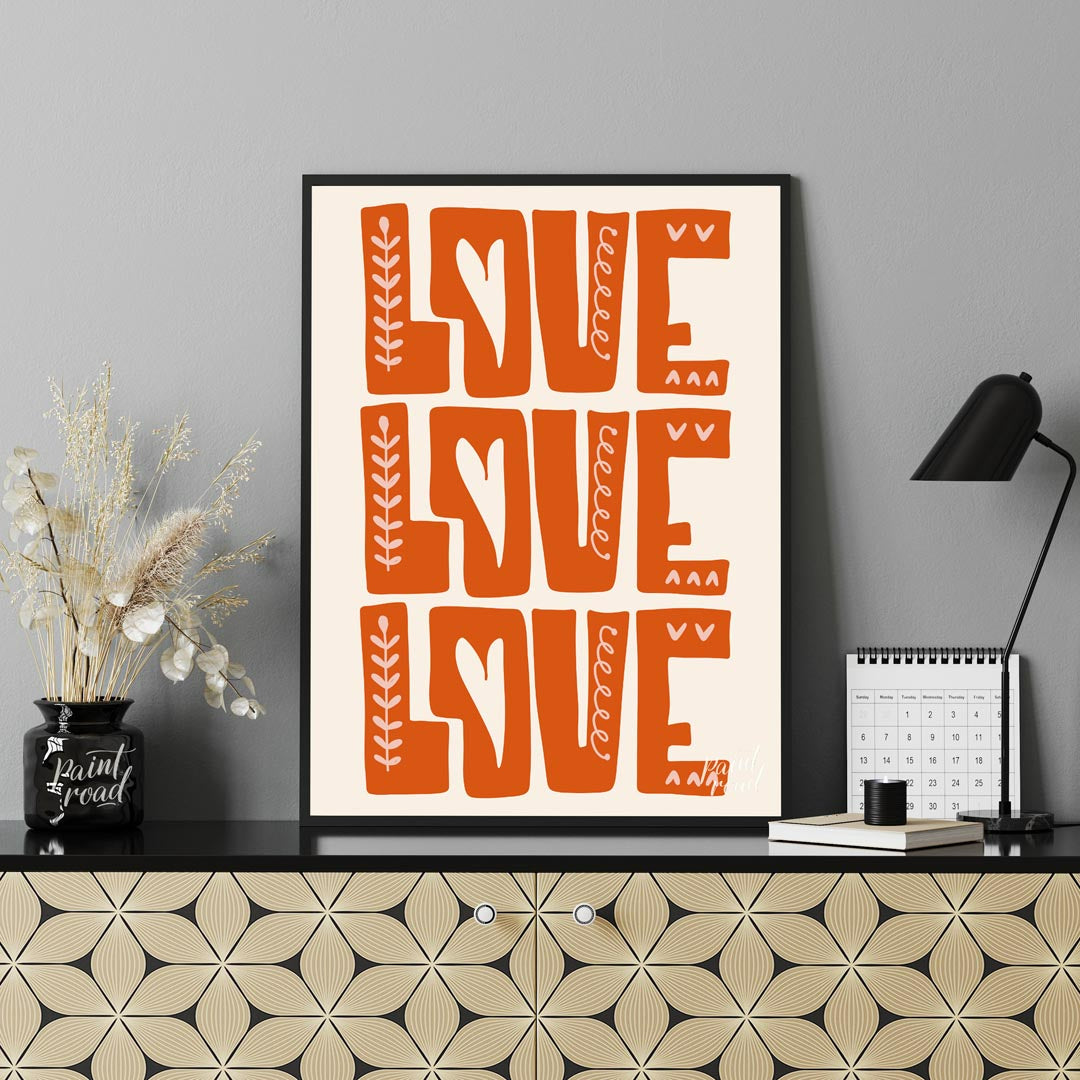 This warm and inviting art print features the word “LOVE” repeated three times in bold, block-lette… for office