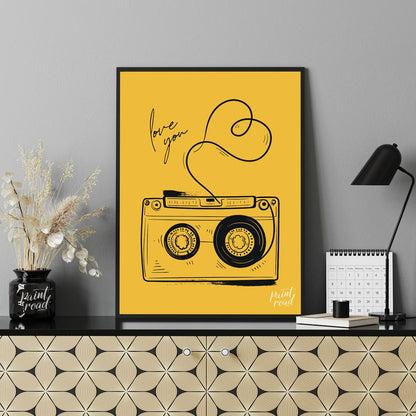 This nostalgic and charming art print features a classic retro cassette tape rendered in a clean, b… for office