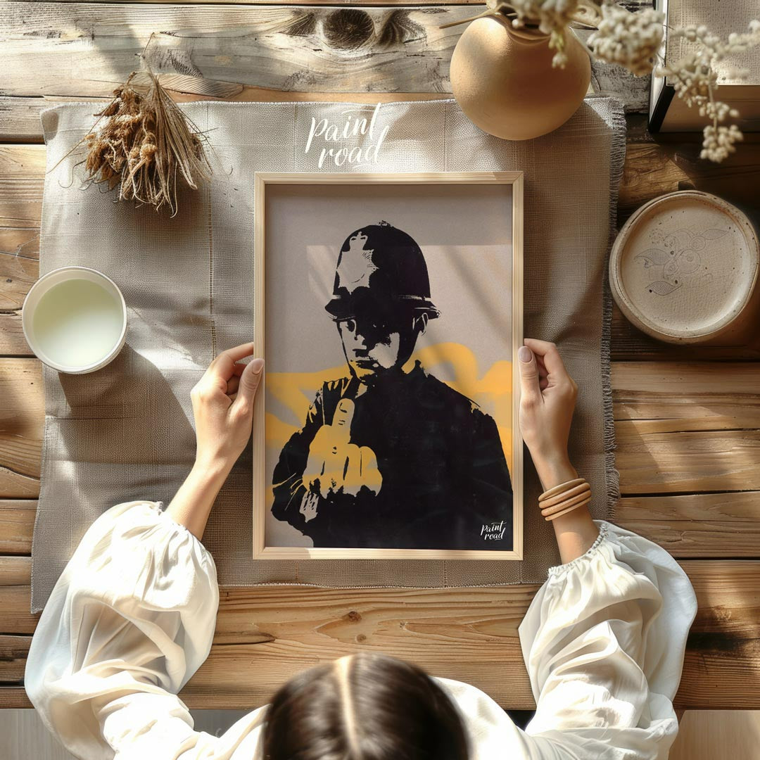This confrontational art print features Banksy’s “Rude Copper” stencil, depicting a British policem… for other