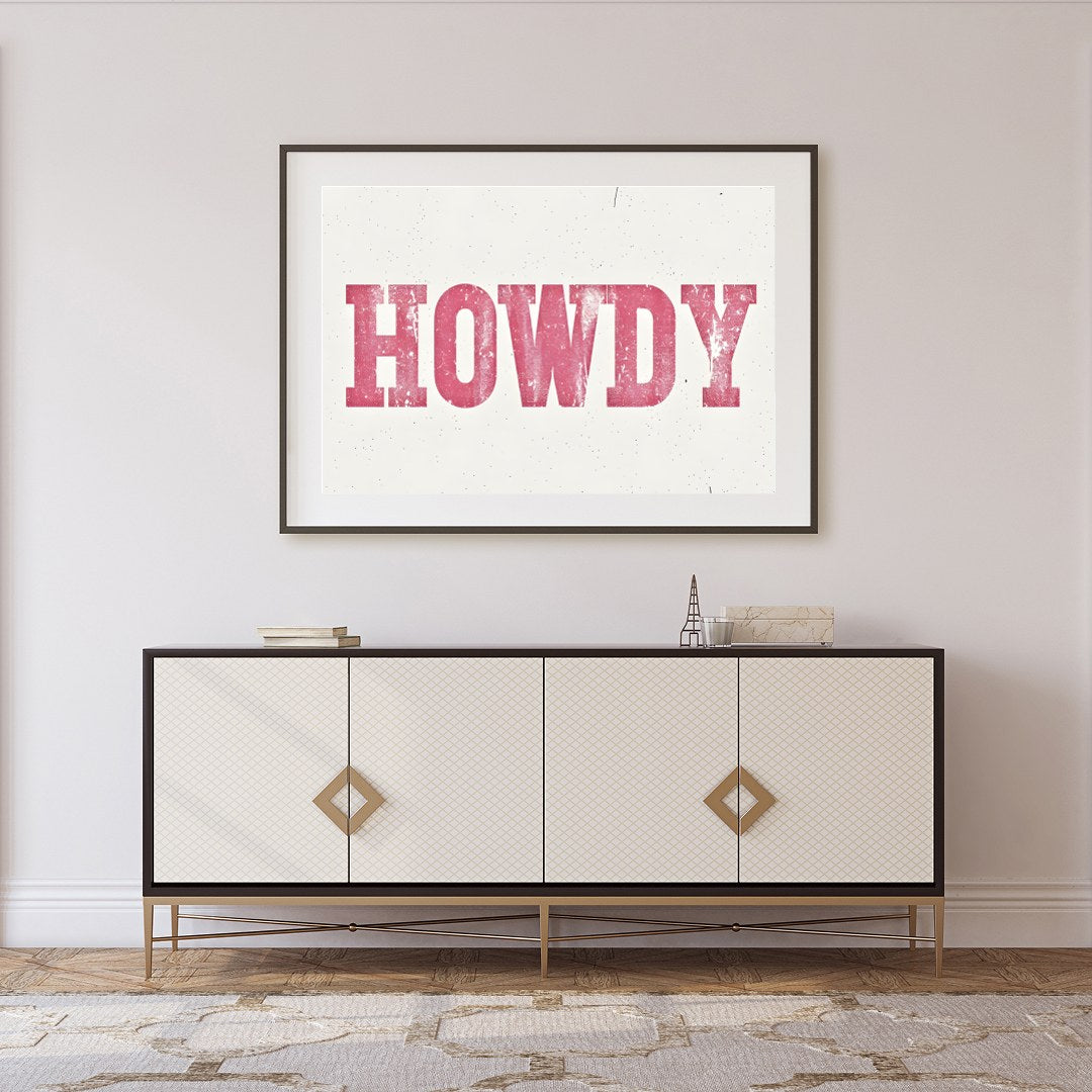 Add a playful Western charm to your space with this 'Howdy' wall art. Featuring a distressed pink for Foyer