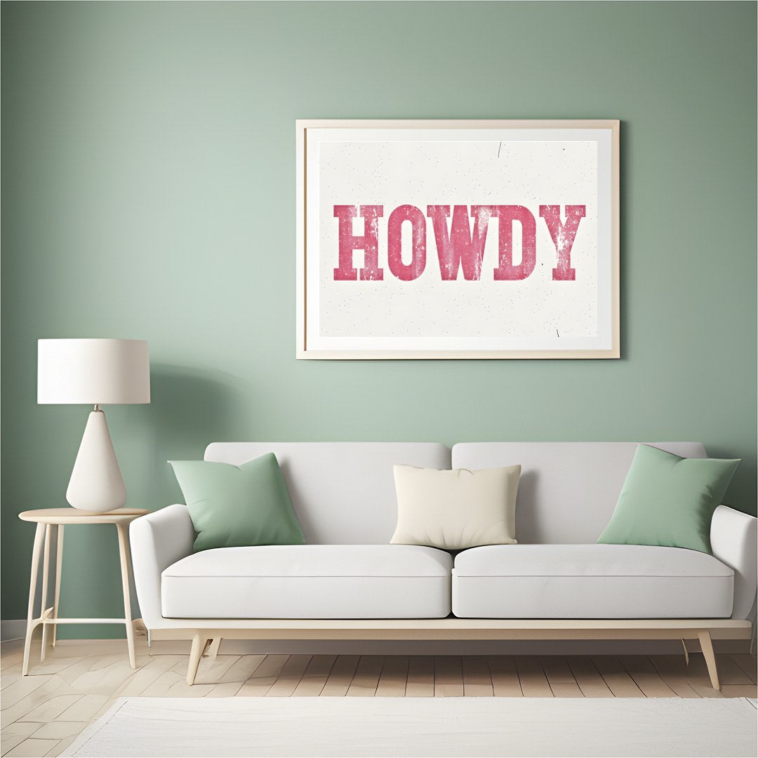 Add a playful Western charm to your space with this 'Howdy' wall art. Featuring a distressed pink for Hall