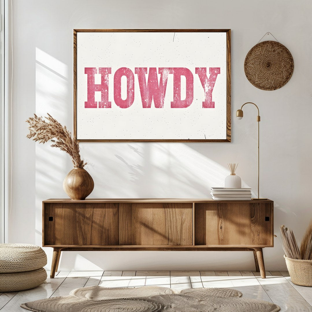 Add a playful Western charm to your space with this 'Howdy' wall art. Featuring a distressed pink for Sitting Area