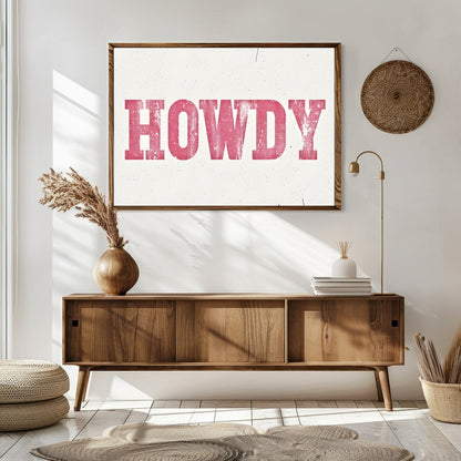 Add a playful Western charm to your space with this 'Howdy' wall art. Featuring a distressed pink for Sitting Area