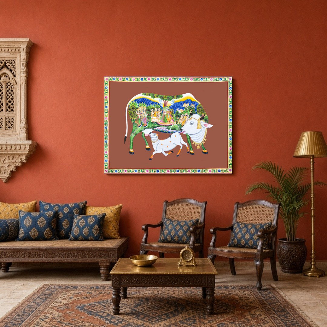 Immerse yourself in the sanctity and beauty of this Pichwai artwork featuring the revered Kamdhenu for Sitting Area