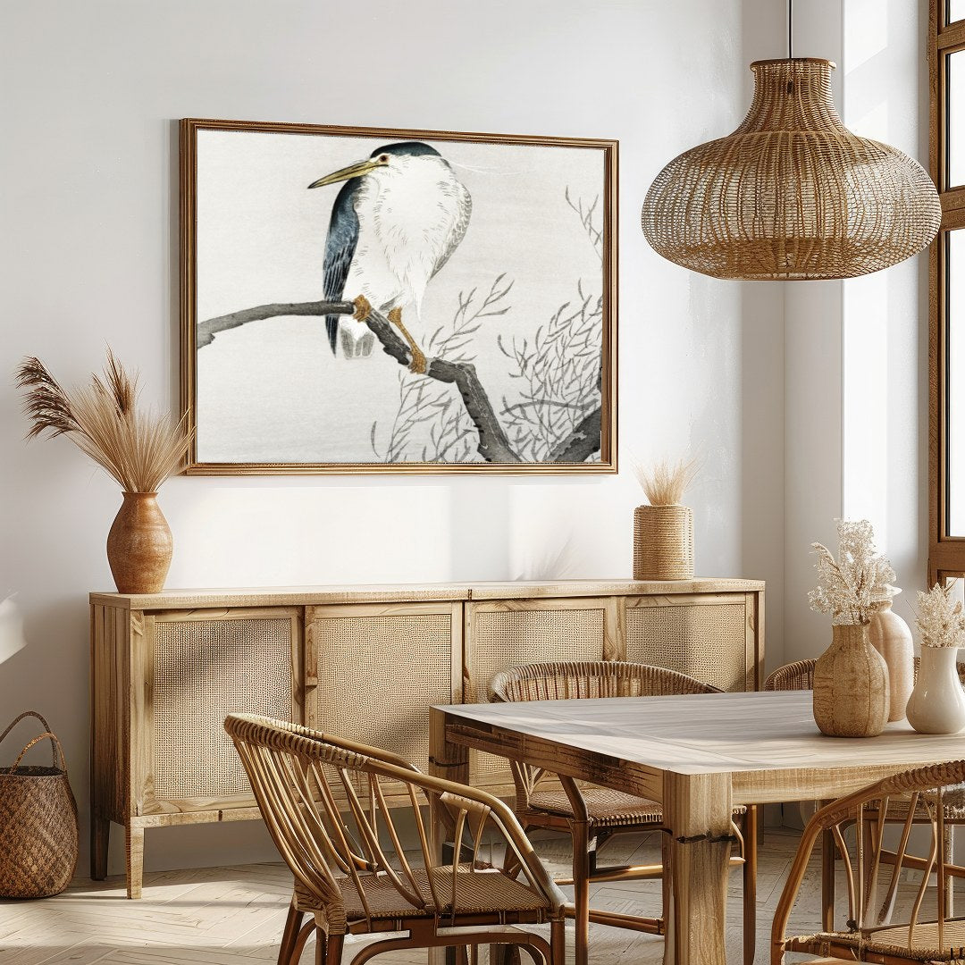 This exquisite artwork captures the tranquil beauty of a heron perched gracefully on a bare branch, for Dining