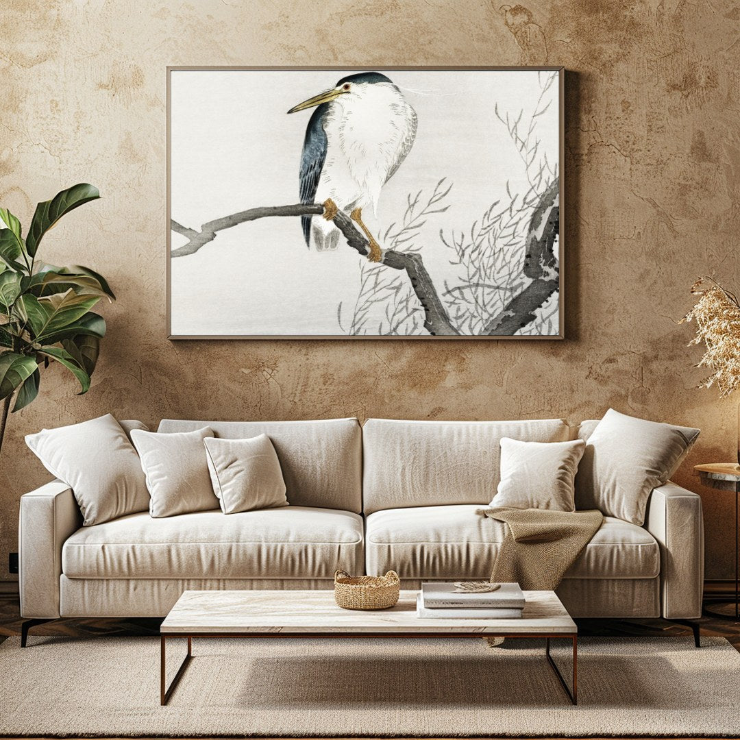 This exquisite artwork captures the tranquil beauty of a heron perched gracefully on a bare branch, for Family Room