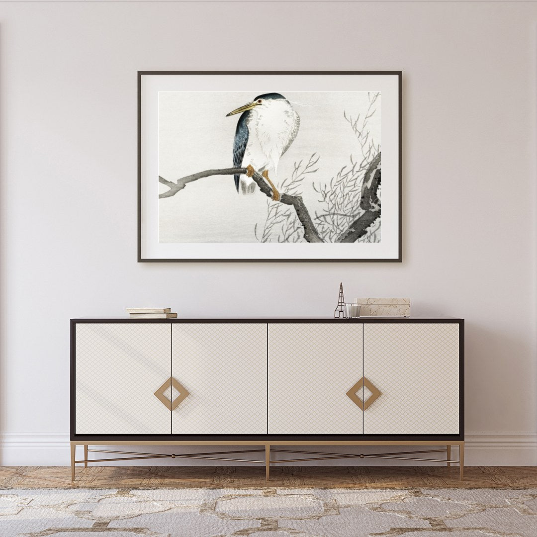 This exquisite artwork captures the tranquil beauty of a heron perched gracefully on a bare branch, for Foyer