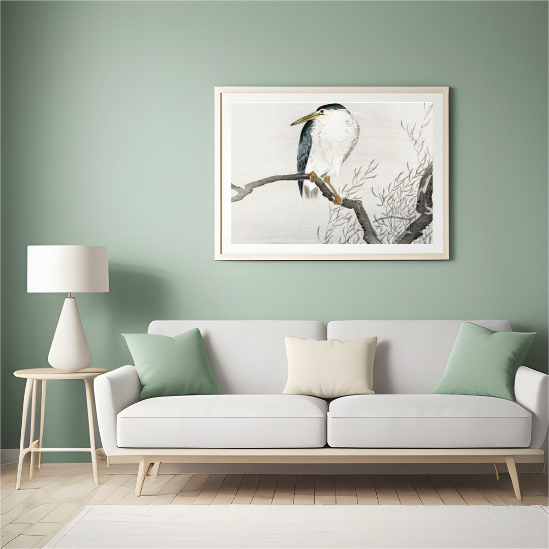 This exquisite artwork captures the tranquil beauty of a heron perched gracefully on a bare branch, for Hall
