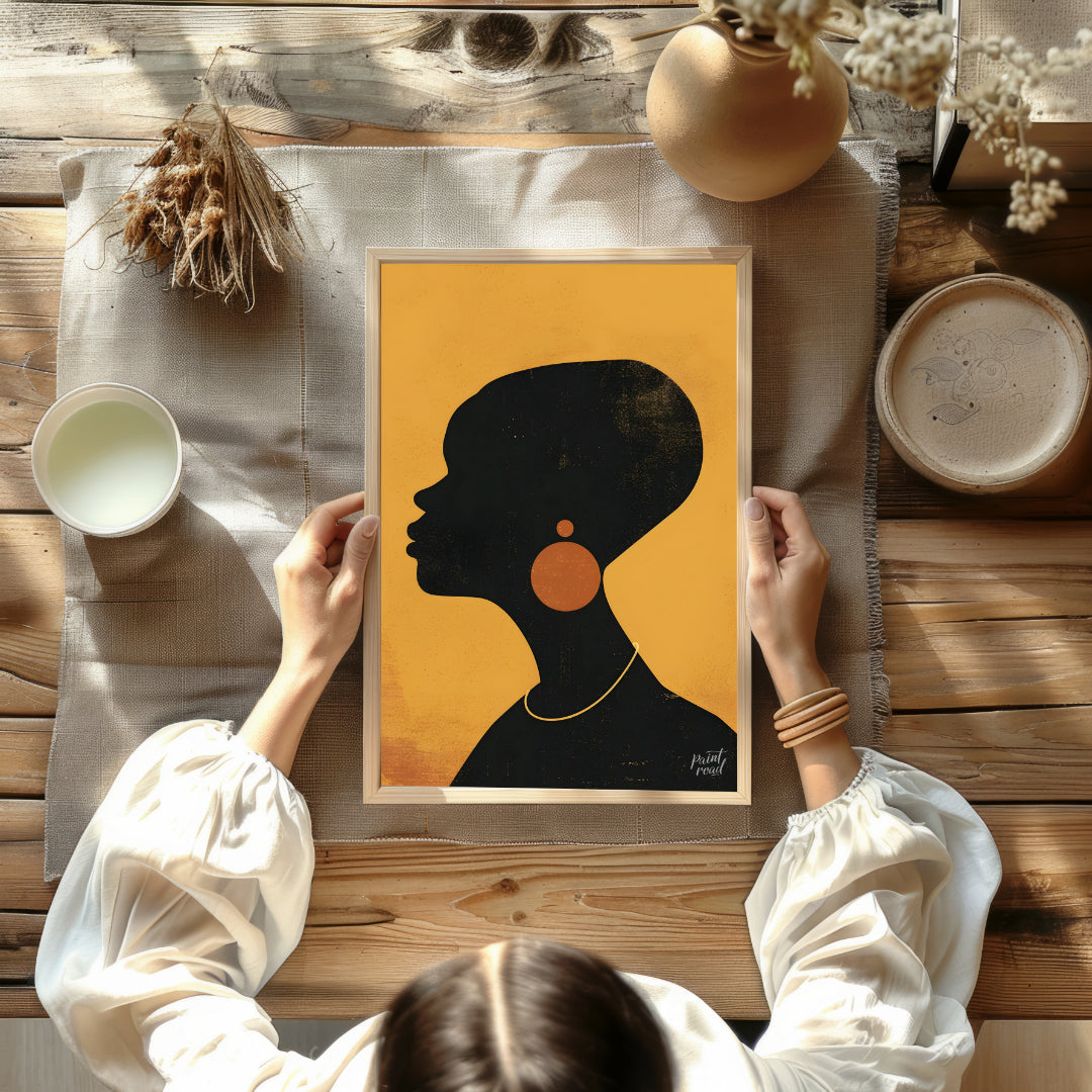 A minimalist and striking portrait of a woman, rendered in bold black and gold tones. The artwork f… for other