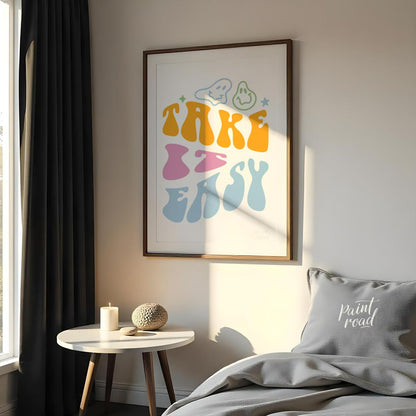 This vibrant and retro-inspired artwork features the phrase “TAKE EASY” in a bold, wavy, and whimsi… for bedroom
