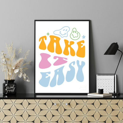 This vibrant and retro-inspired artwork features the phrase “TAKE EASY” in a bold, wavy, and whimsi… for living room