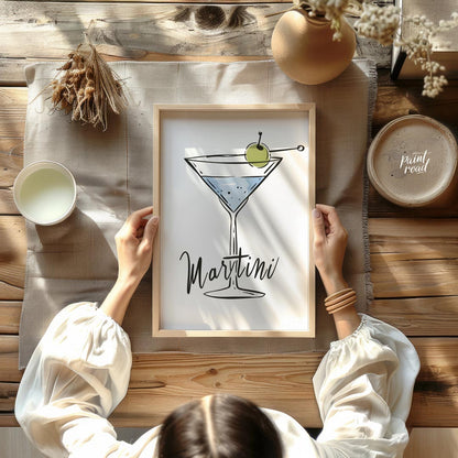 A stylish and minimalist illustration of a classic martini cocktail. The artwork features a hand-dr… for other
