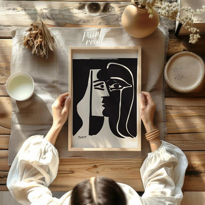 This stark and powerful black and white print, potentially “The Kiss” or a similar emotive work by … for dining room