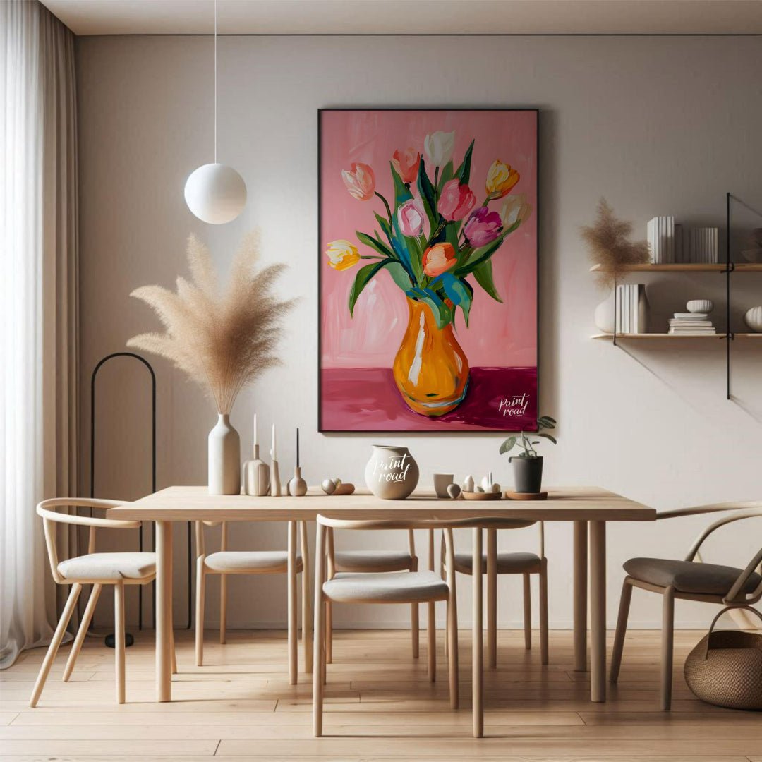 This charming artwork features a bouquet of tulips in a vibrant orange vase, set against a soft pin… for dining room