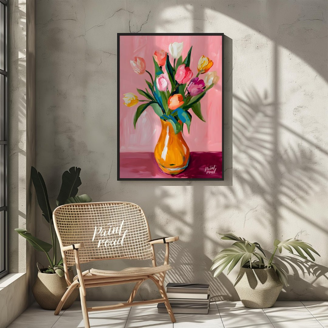 This charming artwork features a bouquet of tulips in a vibrant orange vase, set against a soft pin… for living room
